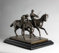 A 19th century bronze group of two racehorses and jockeys raring to go at the start of a race,