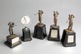 A group of five golf trophies,
including three set with plaques inscribed for the Maw Trophy with