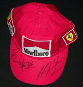 Michael Schumacher signed 2001 Tommy Hilfiger Ferrari team cap,
the peak also bearing the marker pen