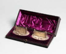 A pair of fine quality Victorian silver plated tennis net knife rests circa 1885,
the bases with a