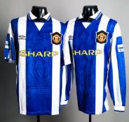Two unnumbered and unnamed blue & white striped Manchester United jerseys prepared for the 1996