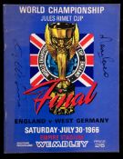 A 1966 World Cup final programme signed by the England goalscorers Geoff Hurst & Martin Peters,