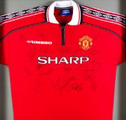 A Manchester United shirt signed by the 1998-99 Treble Winners,
21 signatures in black marker pen,