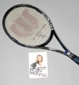 A Steffi Graf tennis racquet used at a French Open,
a Wilson ProStaff 7.1 Flat Beam racquet,