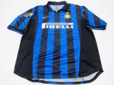 Ronaldo [Luis Nazario de Lima]: a blue & black striped FC Inter No.9 jersey,
short-sleeved,