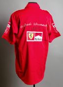 Michael Schumacher Scuderia Ferrari signed shirt,
His marker pen signature beneath his embroidered