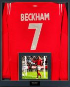 A signed David Beckham England 2002 World Cup red replica jersey, reverse mounted, signed in black