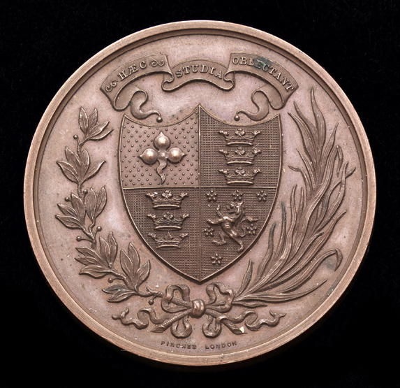 A Victorian bronze medal for swimming,
by John Pinches of London, coat of arms and Latin motto