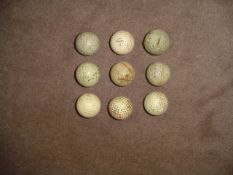 Nine golf balls,
including two brambles, a Dunlop Red Spot and a Silver King, 2 brambles, and an '