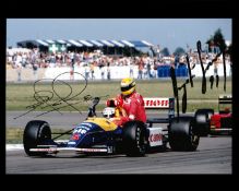 Double-signed photograph of Nigel Mansell giving Ayrton Senna a lift post 1991 British GP,
their ink