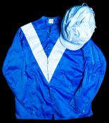 A set of Maktoum Al Maktoum racing silks,
royal blue with light blue 'V' and cap, tears to back just