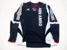 Hedwiges Maduro: a navy blue Ajax No.8 UEFA Champions League away jersey season 2005-06, long-