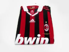 Clarence Seedorf: a red & black striped AC Milan No.10 Serie A jersey season 2009-10, long-sleeved,