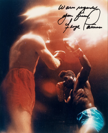 A signed colour photograph of Floyd Patterson, 9 by 7in., mounted, framed & glazed, 46 by 42cm., 18