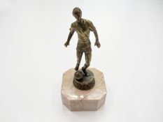 A metalware figurine of a footballer, on a marble base, 20cm., 8in. Provenance: Torino Olympic