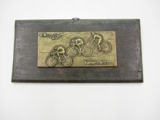 A brass cycling plaque celebrating the Spanish cyclist Federico Martin Bahamontes winner of the