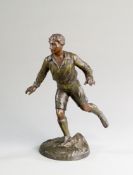 A small spelter figure of a footballer, posed setting off on a run, naturalistic base, height 23.