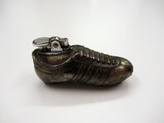 A table cigarette lighter with football boot design Provenance: Torino Olympic Stadium Museum of