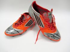 Urby Emanuelson: a signed pair of orange & silver Adidas F50 Sprint Frame football boots 2013,
