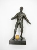 A spelter footballer, replacement ball on base, 25.5cm., 10in. Provenance: Torino Olympic Stadium