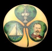 A very rare Americas Cup pin badge probably relating to the 1899 race, tin, with shamrock design to