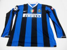 Olivier Dacourt: a blue & black striped FC Inter No.15 UEFA Champions League jersey season 2006-07,