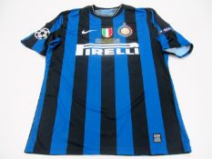 Diego Milito: a blue & black striped FC Inter 2010 UEFA Champions League Final No.22 jersey, short-