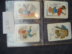 Four ""Happy Families"" Victorian playing cards titled ""Footballing"", each card sub-titled