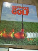5 volumes of ""Improve Your Golf"" in folders, titled Star Players, Aim & Grip, Problem Solver,