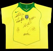 A signed framed Brazil jersey, signed in black marker pen by Ronaldinho, Ronaldo, Kleberson,