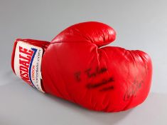A boxing glove double-signed by Muhammad Ali & Joe Frazier, the Ali signature dedicated to the