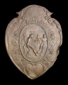 A spelter plaque originally fitted to a football trophy shield circa 1930s, with a football scene,