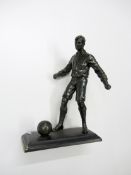 A spelter footballer, modelled with the ball at his feet, 25.5cm., 10in. Provenance: Torino Olympic