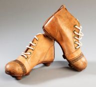 A pair of child`s size vintage leather football boots, in virtually unused condition, English