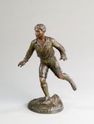 A small spelter figure of a footballer,
posed setting off on a run, naturalistic base, height 23.