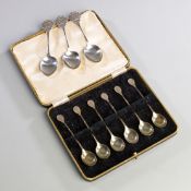 Silver tennis spoons,
a cased set of six spoons hallmarked Sheffield, 1936; together with three