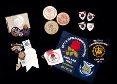 A collection of 19 Commonwealth Games medals and badges relating to the career of John Wardley,
