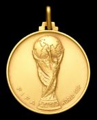 A FIFA 1974 World Cup gold winner's medal,
continental hallmark .750/K18 by Bertoni of Milano, the