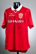 A squad-signed Manchester United 1999 Champions League Final commemorative jersey,
22 signatures