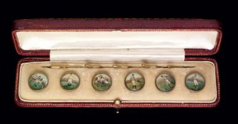 A cased set of six Edwardian gentlemen's waistcoat buttons set with coloured prints of football