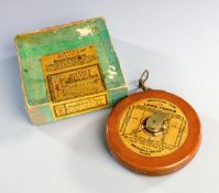 A boxed "Rabone's Rigida" lawn tennis measuring tape,
the leather cased spool with linen label