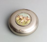 A football tobacco box circa 1910,
in white metal, the hinged lid set with a circular print of a