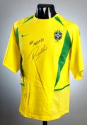 A replica Brazil jersey signed by Rivaldo,
a four-star replica, signature in black marker pen an