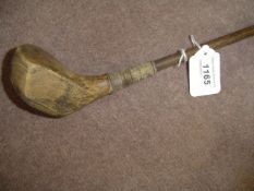 An A.H. Scott of Elie patent spliced neck brassie circa 1920,
poor condition, original hickory shaft