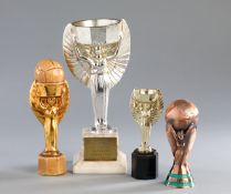 Three miniature replicas of the Jules Rimet Trophy,
i) F.A. commemorative in lacquered gilt on a