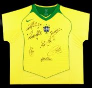 A signed framed Brazil jersey,
signed in black marker pen by Ronaldinho, Ronaldo, Kleberson,