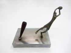 A desk pen holder with a sculpture of a footballer

Provenance: Torino Olympic Stadium Museum of