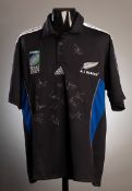 A team-signed New Zealand All Blacks 2007 Rugby World Cup replica shirt,
15 signatures in silver
