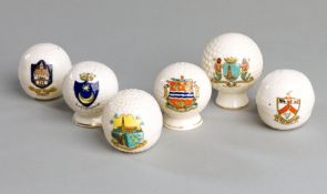 A collection of 28 crested china golf balls,
some in the form of salts, all in good condition