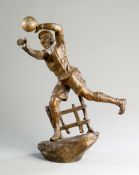 A spelter goalkeeper figurine,
from a Belgian clock garniture, the goalie modelled making an